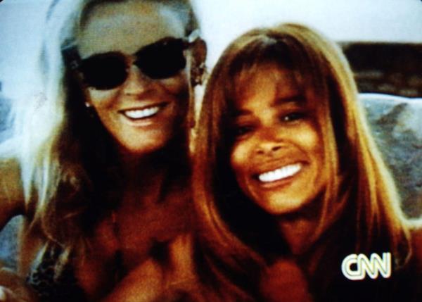 Nicole Brown Simpson and Faye Resnick smiling during CNN's coverage of the Simpson trial